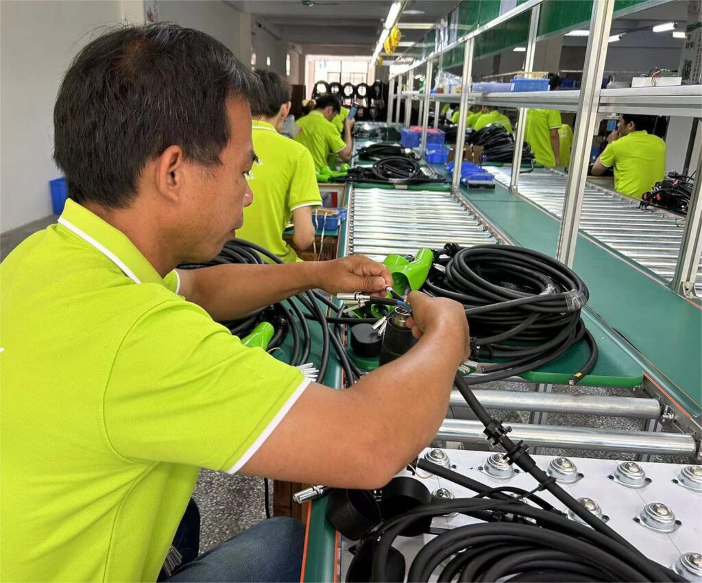Worker is producing EV charger